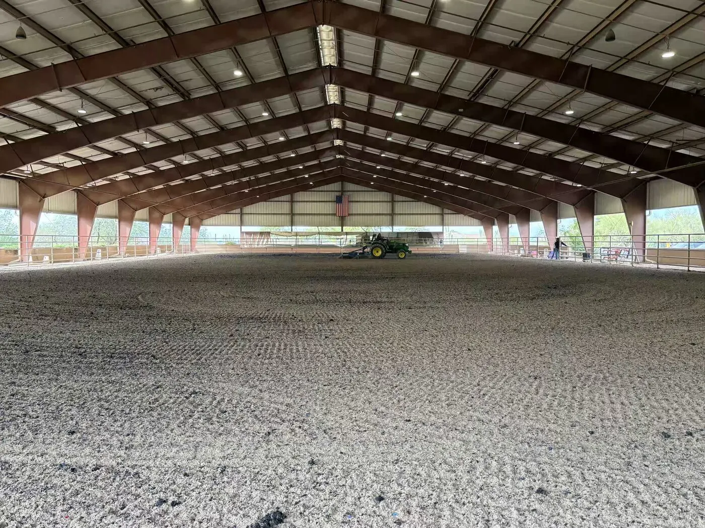 Finished covered arena with an even groomed surface ready for use