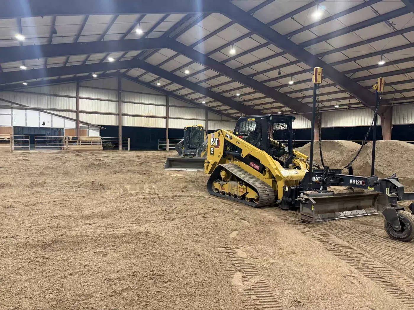 Laser grading box finishing footing inside a covered riding arena